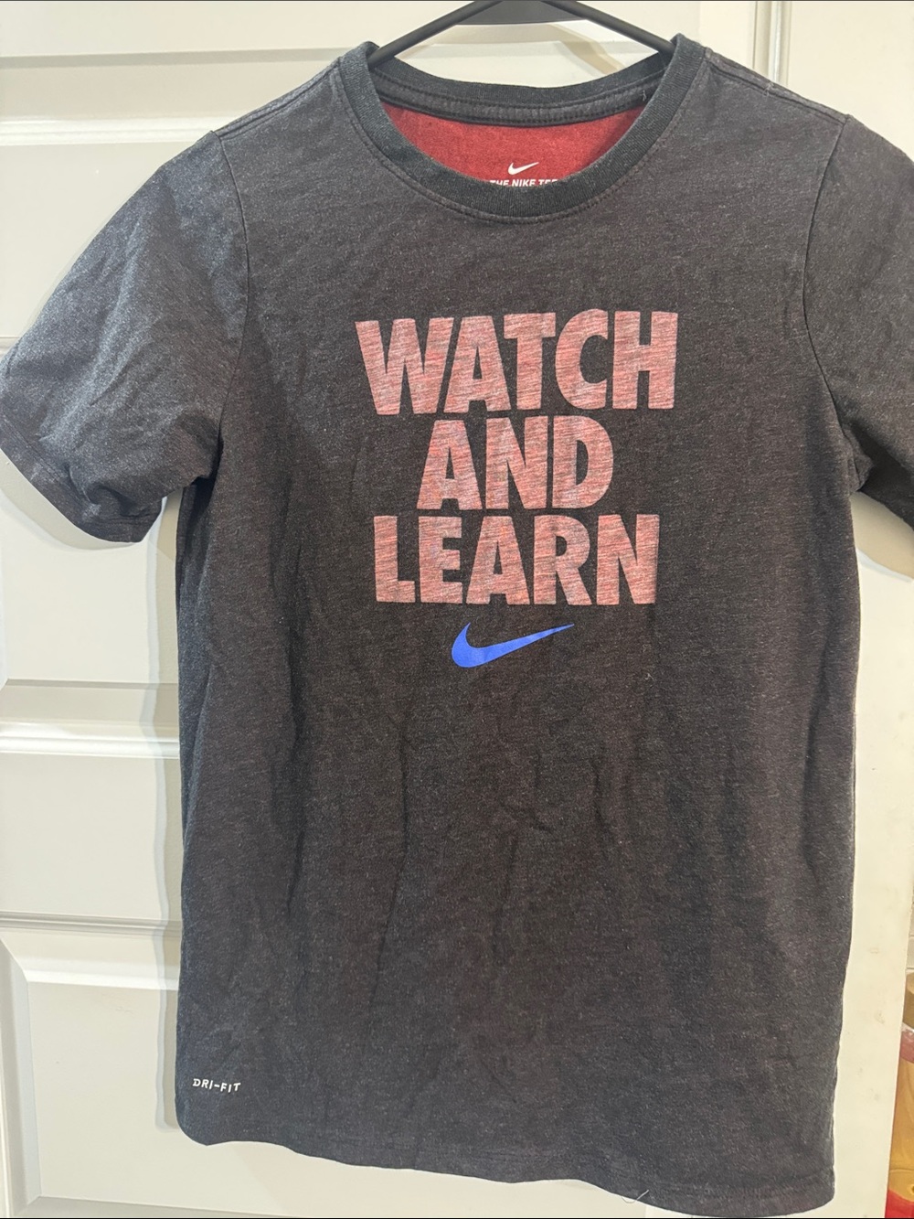 Nike Short Sleeve Tee in Black with multi Text and Blue Swoosh